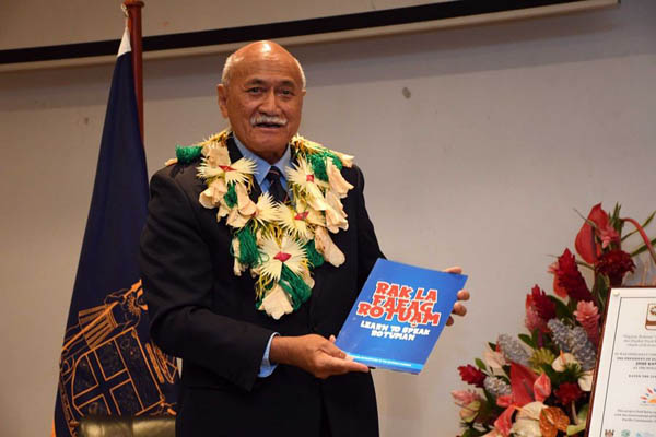 Gen. Konrote holding Rotuman Language Book