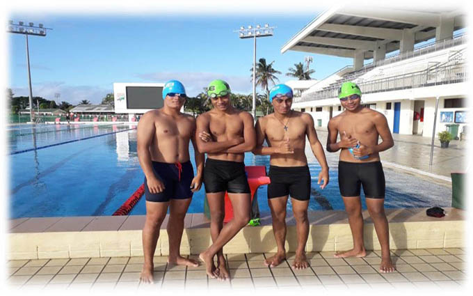 Boys with new swimming caps